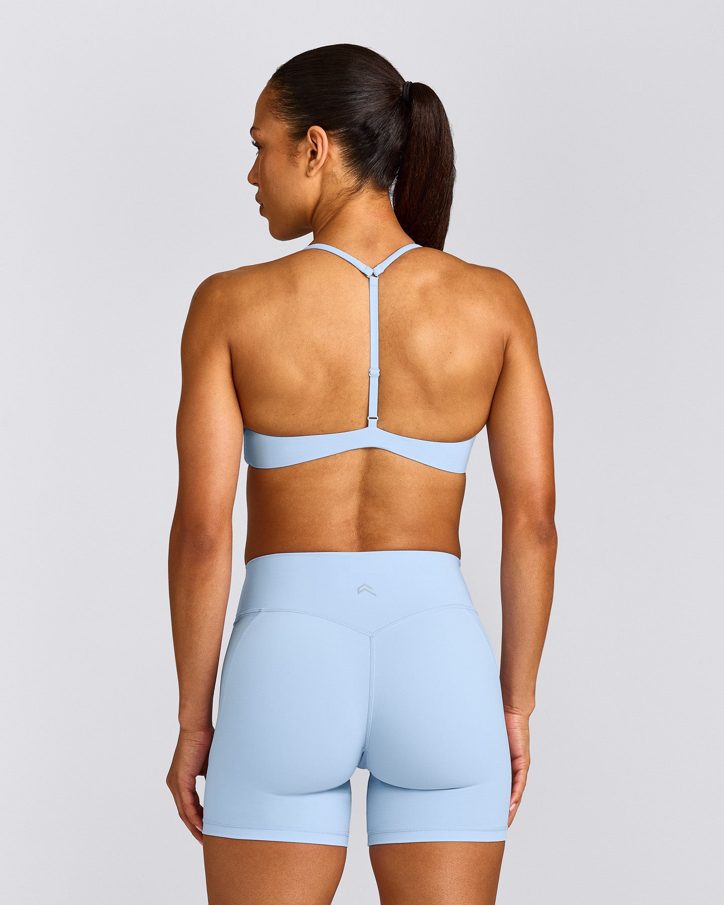 UnifiedMove™ T Back Minimal Bralette with Reflective Logo | Powdered Blue