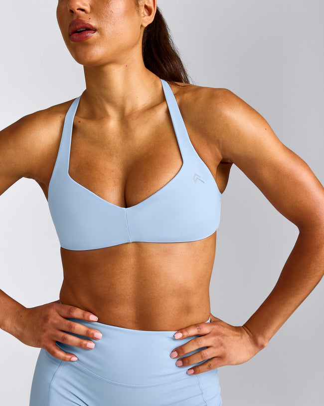 UnifiedMove™ T Back Minimal Bralette with Reflective Logo | Powdered Blue