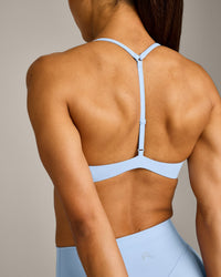 UnifiedMove™ T Back Minimal Bralette with Reflective Logo | Powdered Blue