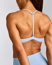 UnifiedMove™ T Back Minimal Bralette with Reflective Logo | Powdered Blue