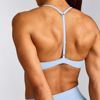 UnifiedMove™ T Back Minimal Bralette with Reflective Logo | Powdered Blue
