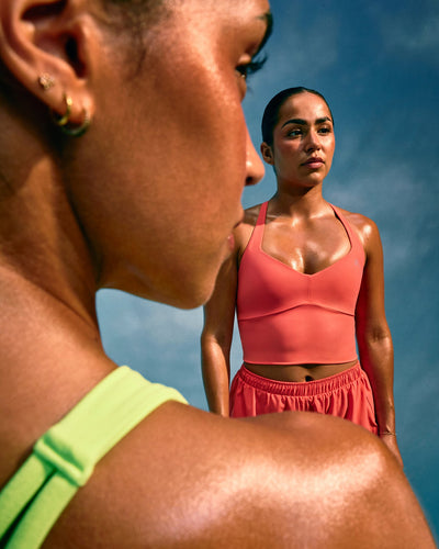 UnifiedMove™ T Back Mid Vest with Built in Bra Shelf with Reflective Logo | Light Charged Coral