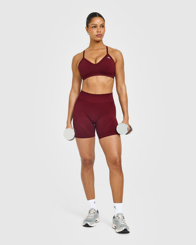 EnhanceLift™ Seamless Strappy Sports Bra with White Logo | Rosewood