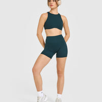 SoftMotion™ High Neck Sports Bra with White Logo | Oil Blue