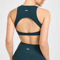 SoftMotion™ High Neck Sports Bra with White Logo | Oil Blue