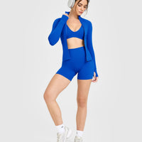 SoftMotion™ Scoop Back Bralette with White Logo | Light Cobalt Blue
